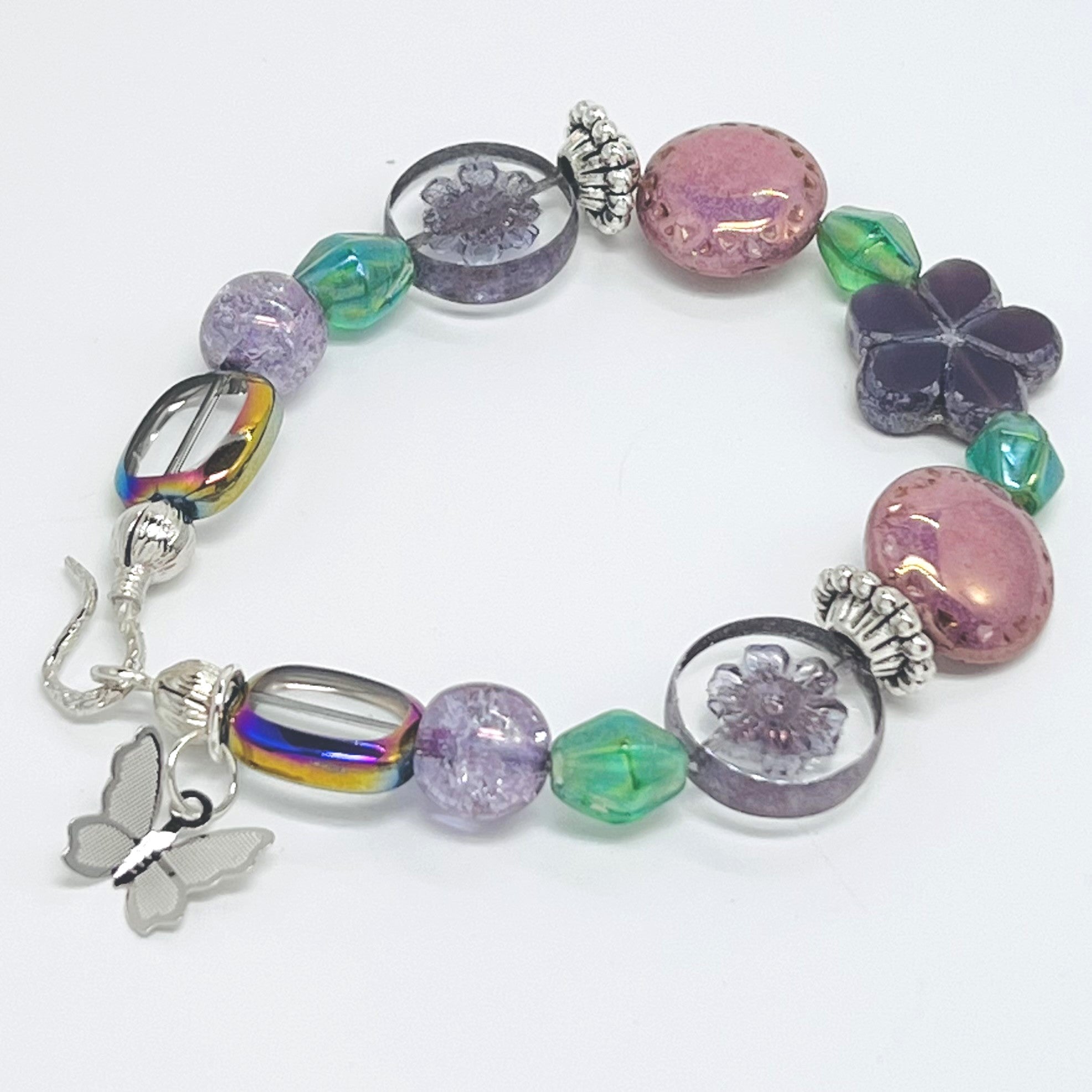 Romantic bracelet and earring set with Czech beads, glass beads in purple, pink and green with a silver butterfly dangle and silver accents