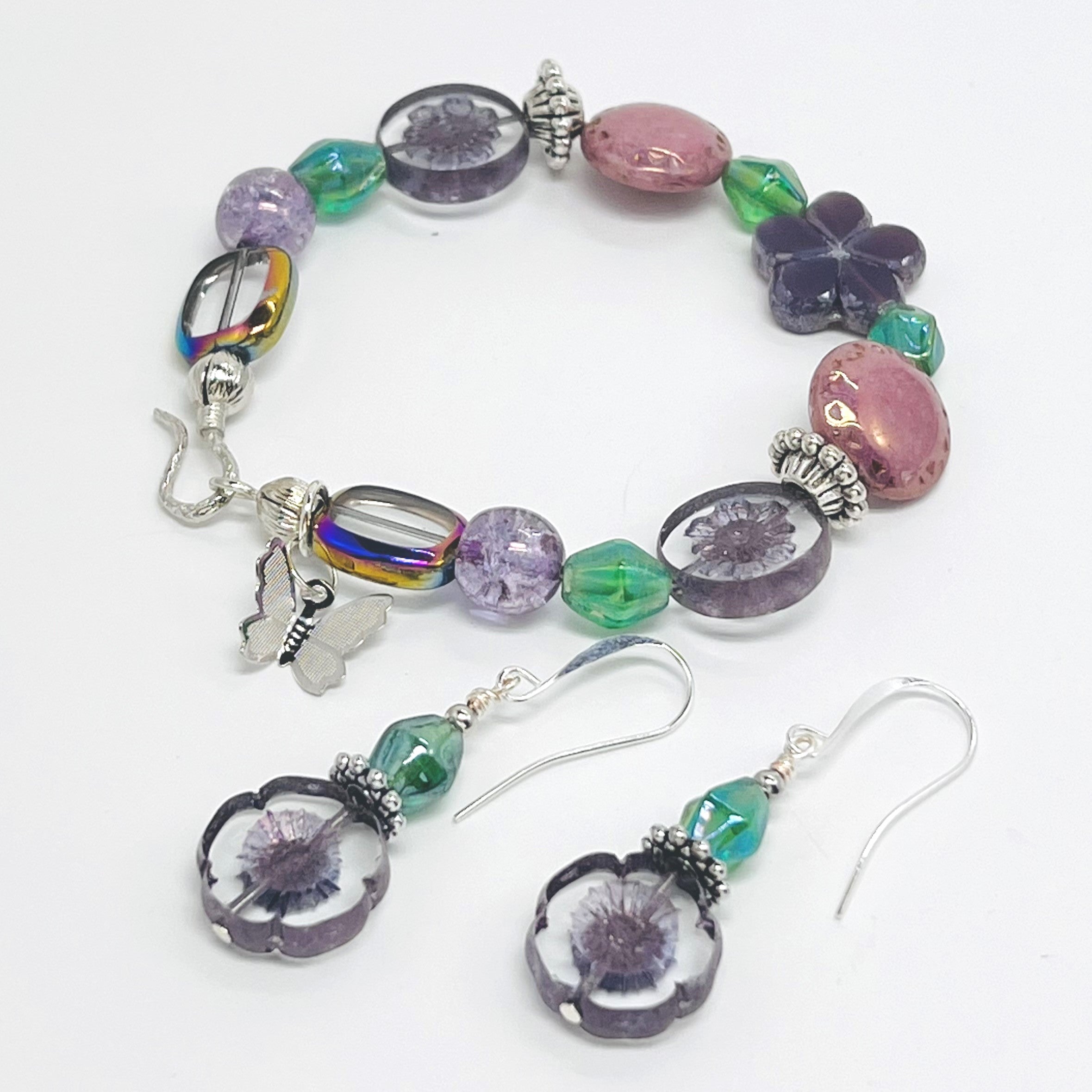 Romantic bracelet and earring set with Czech beads, glass beads in purple, pink and green with a silver butterfly dangle and silver accents