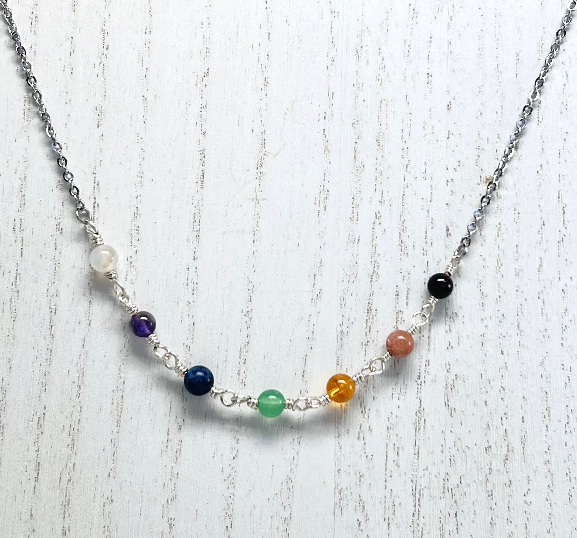 Chakra gemstones and silver necklace and earring set