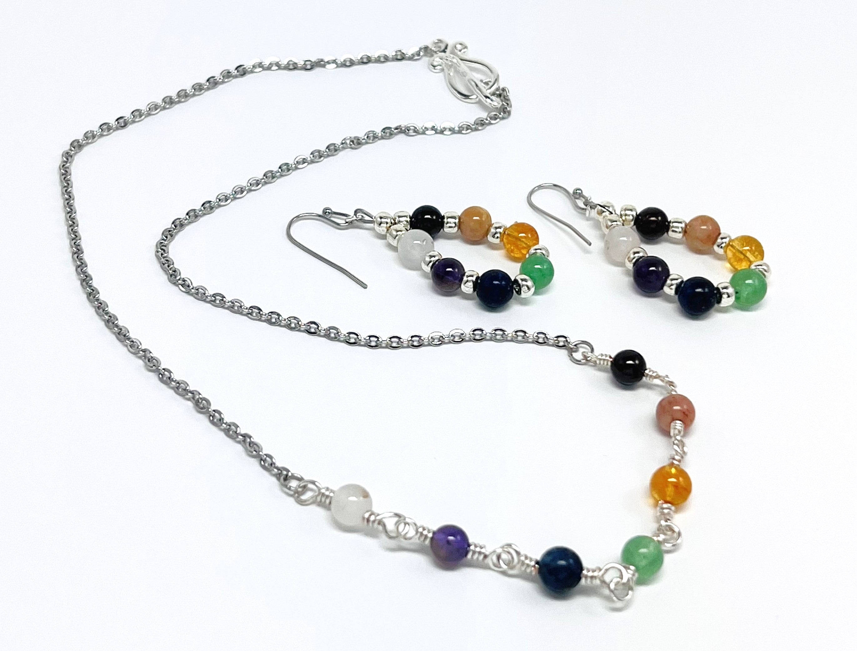 Chakra gemstones and silver necklace and earring set