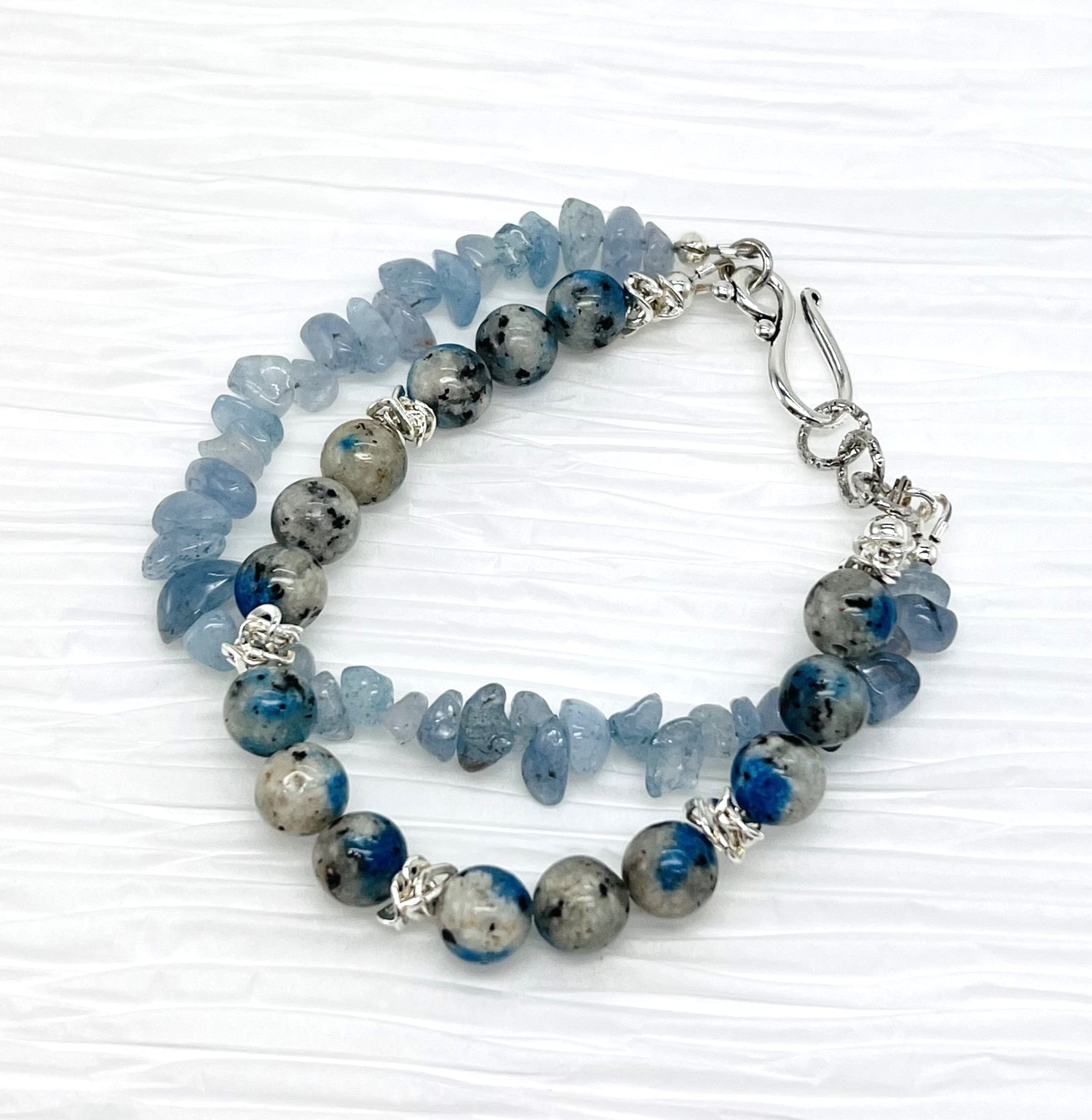 Peace and goodwill abound with this lovely Aquamarine and a Afghanite (K2) stone bracelet and earring set