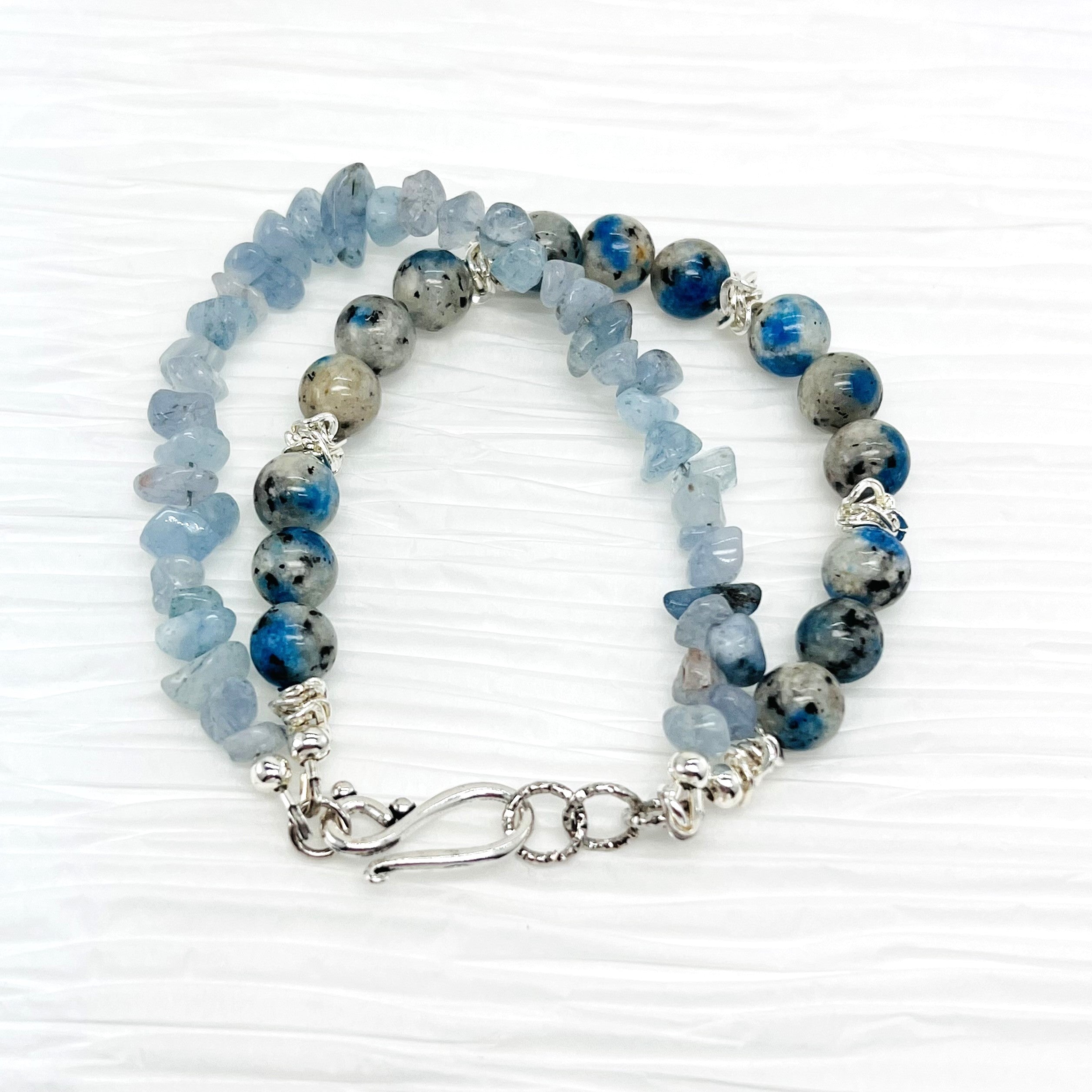 Peace and goodwill abound with this lovely Aquamarine and a Afghanite (K2) stone bracelet and earring set