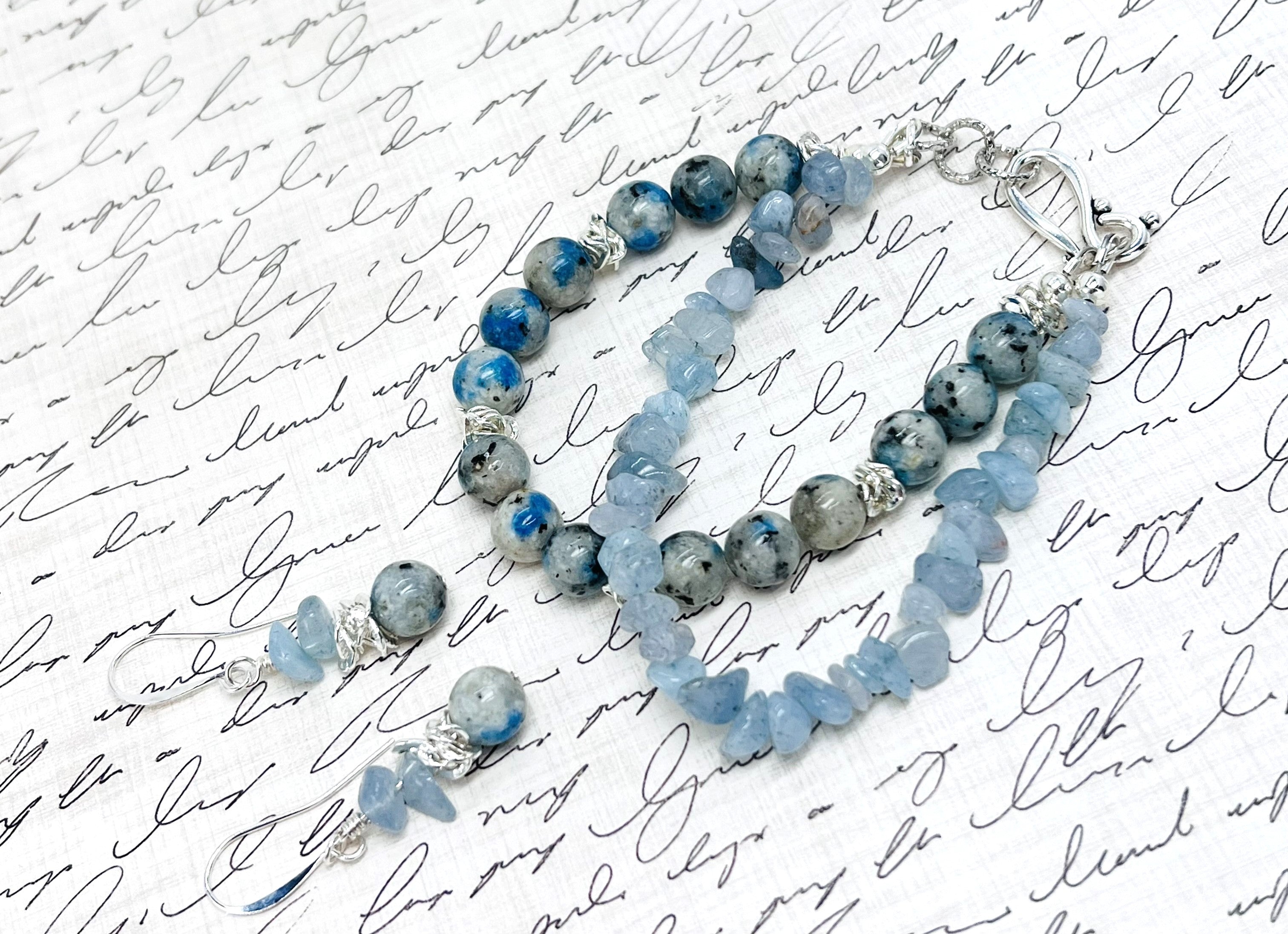 Peace and goodwill abound with this lovely Aquamarine and a Afghanite (K2) stone bracelet and earring set