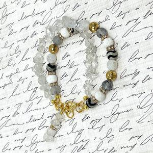 Bracelet and earring set of white quartz chips combined with glass, lava and stone beads accented with gold metals