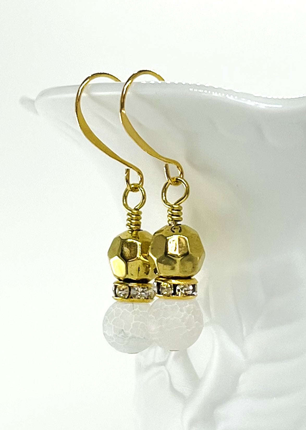 Bracelet and earring set of white quartz chips combined with glass, lava and stone beads accented with gold metals