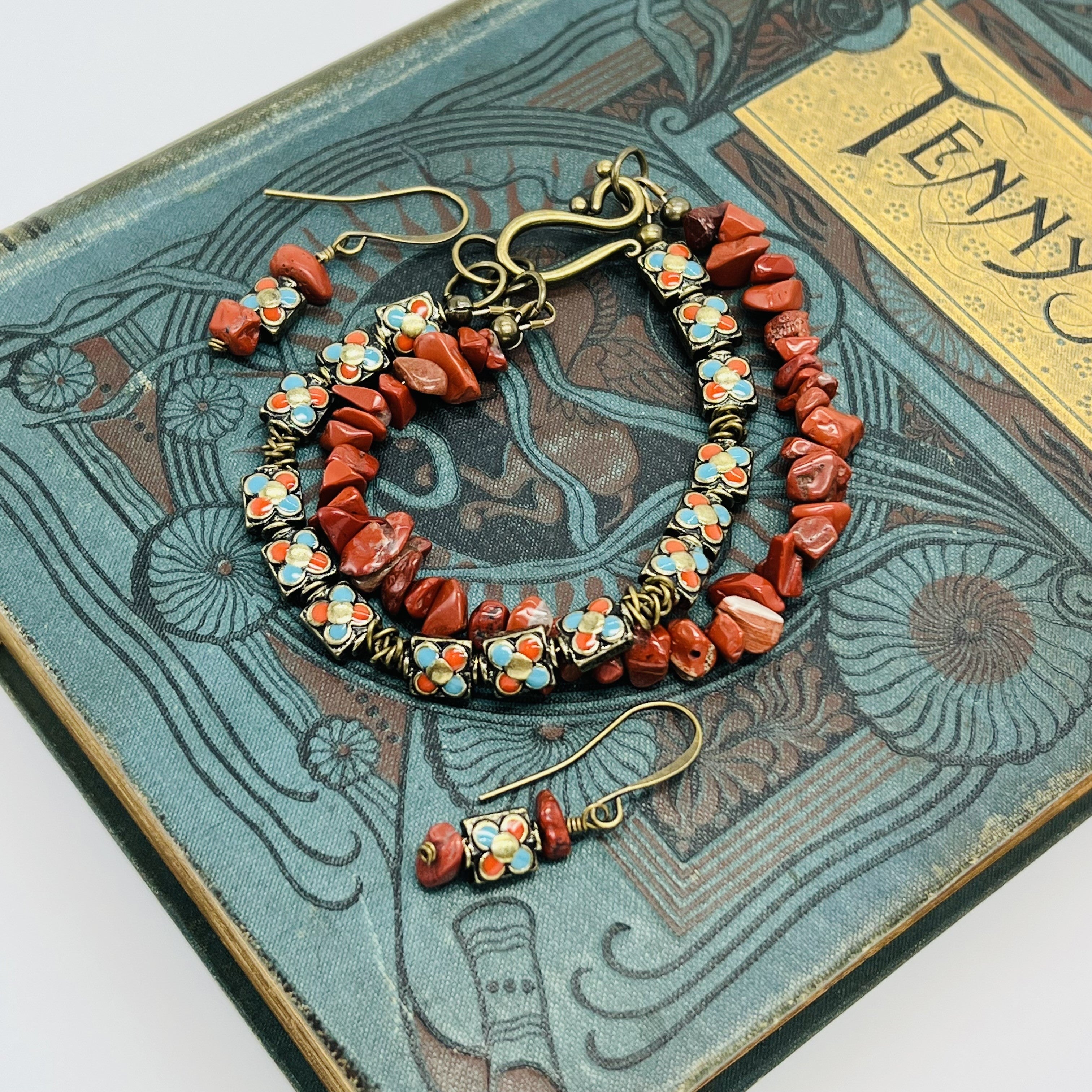 Red jasper chips and turquoise and gold enameled beads in this stunning bracelet and earring set