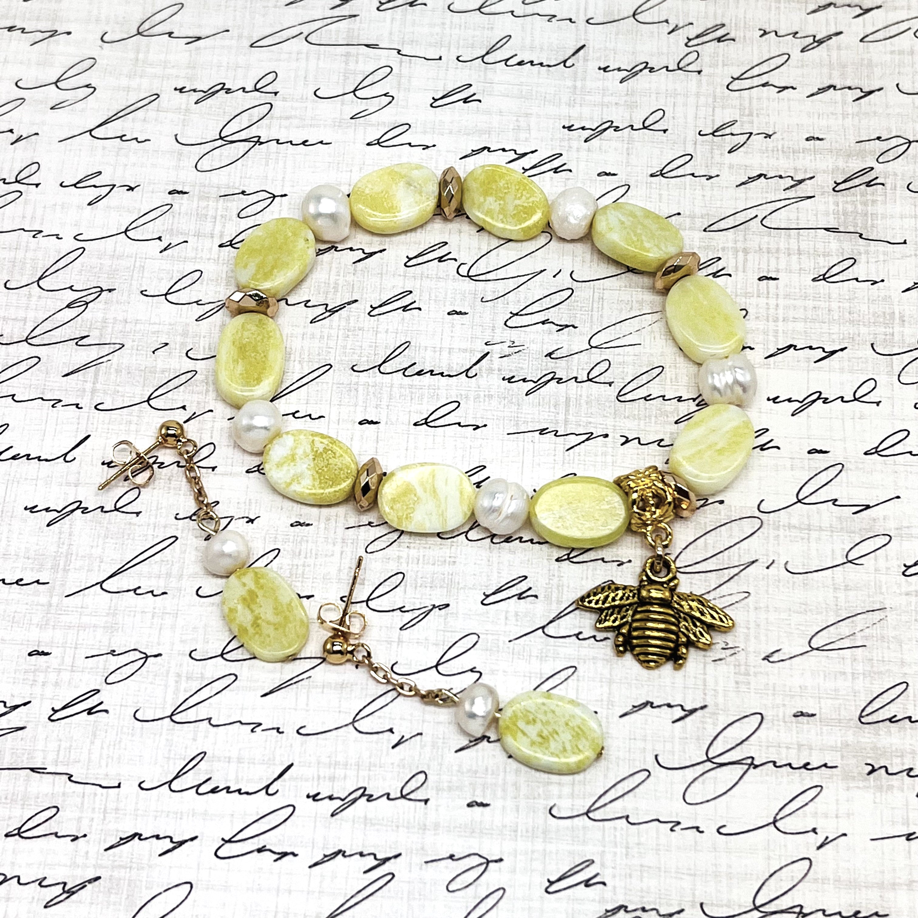 Lovely lemony yellow semiprecious agate stretchy bracelet with pearls and a bee charm with gold hemitite accents