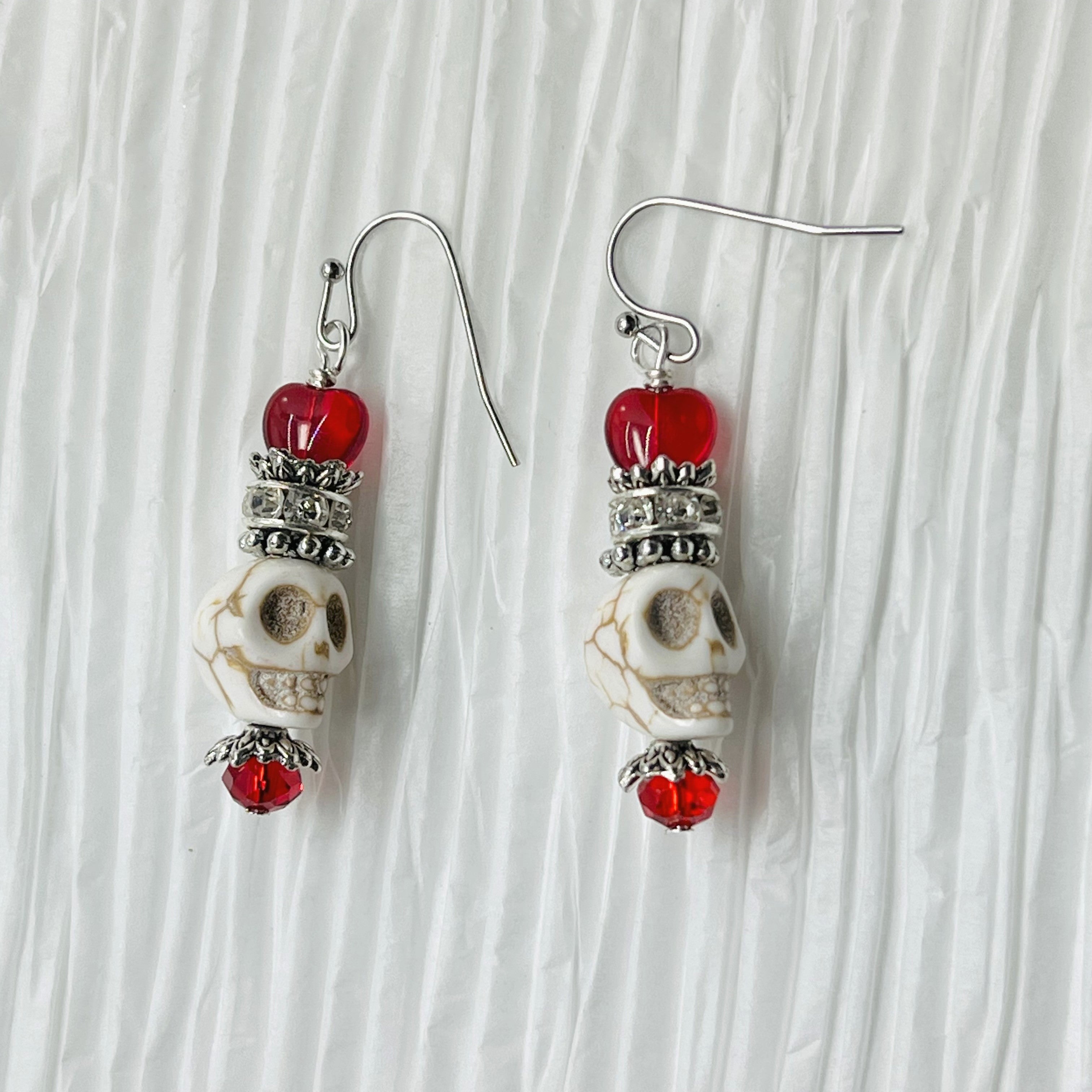 Skull earrings in white Wagnerite and red Czech glass heart beads