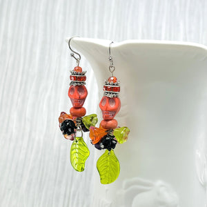 Skull earrings, orange, green, purple and black with rhinestone rondels and silver accents