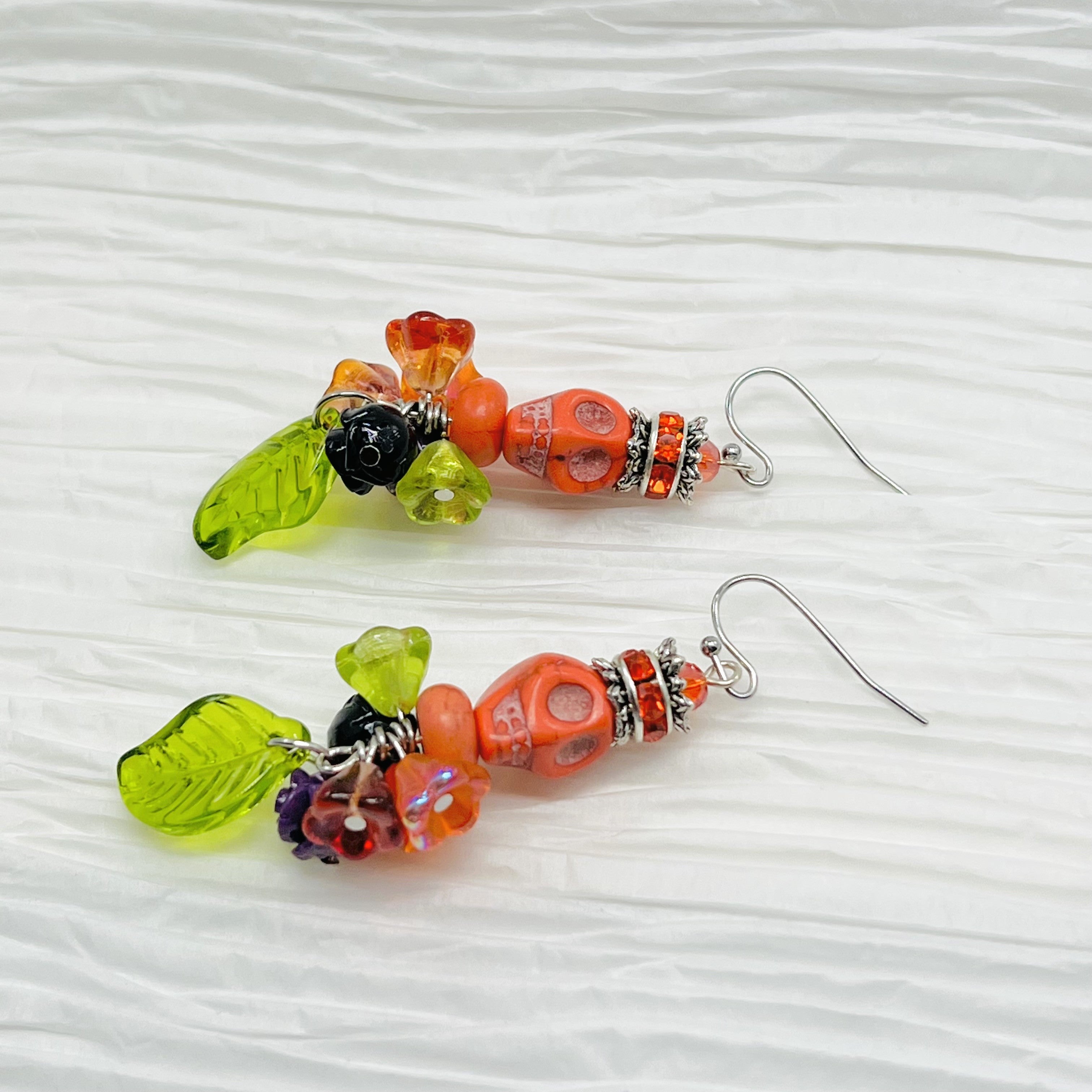 Skull earrings, orange, green, purple and black with rhinestone rondels and silver accents