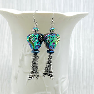 Spooky iridescent glass skull earrings with silver accents