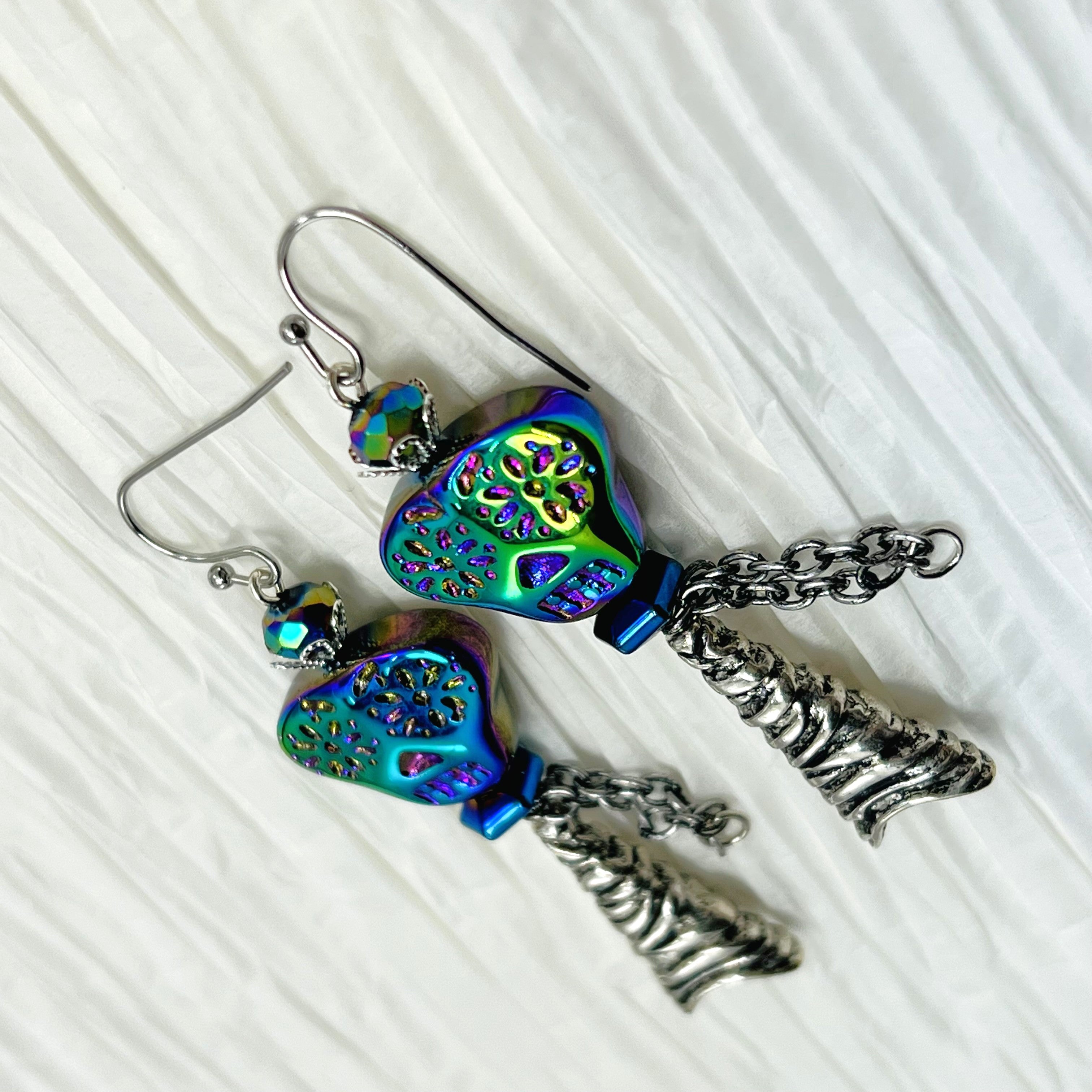 Spooky iridescent glass skull earrings with silver accents