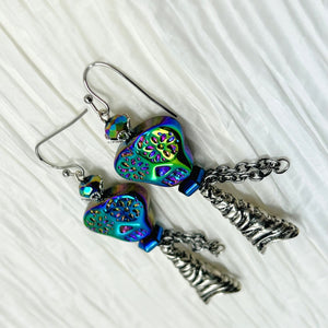 Spooky iridescent glass skull earrings with silver accents