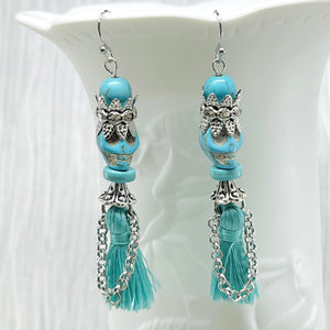 Fancy turquoise Wagnerite skull earrings with sparkling crown and tassel skirt