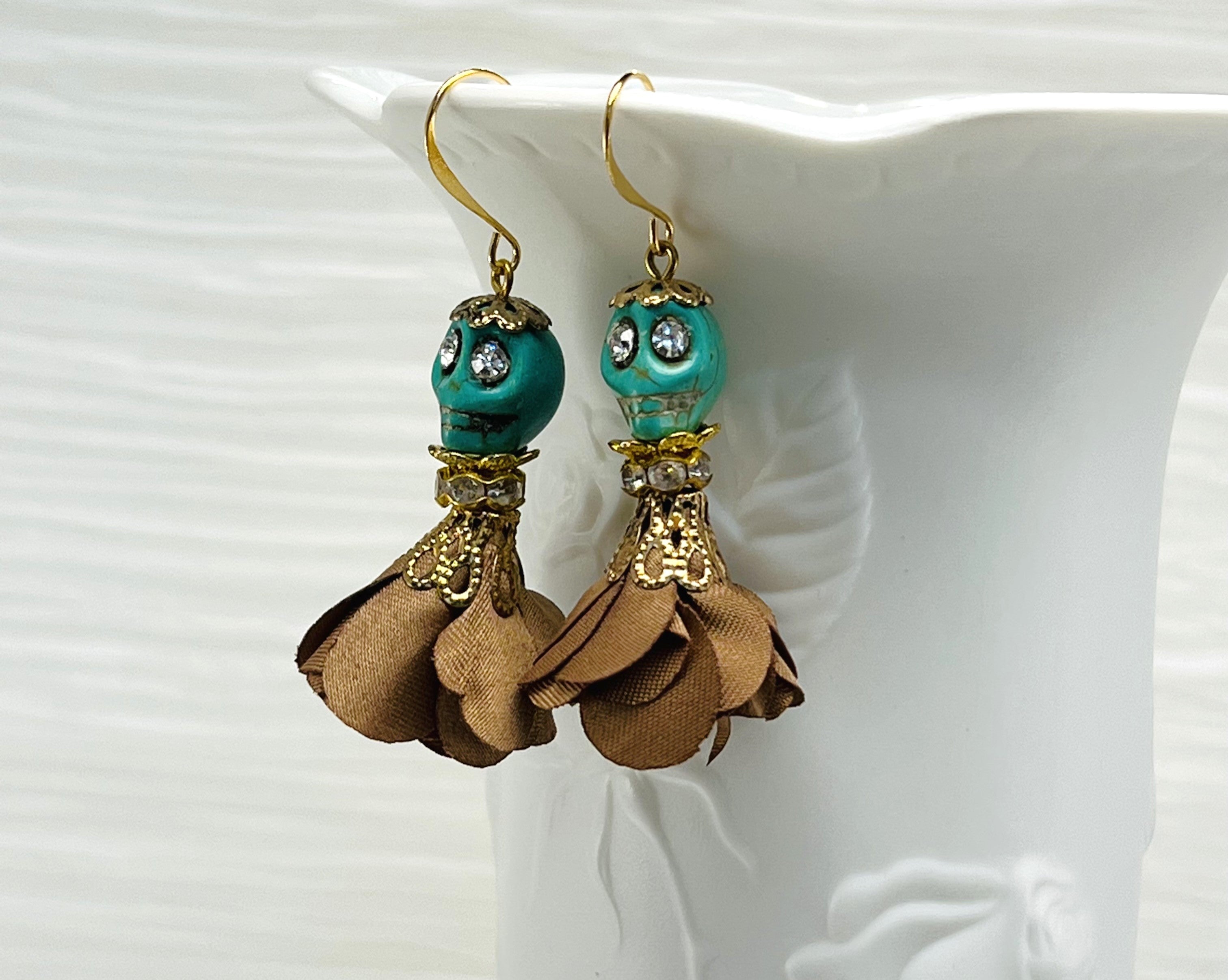 Sweet turquoise Wagnerite skull earrings with sparkly eyes and a lovely flowing brown silk skirt and gold accents