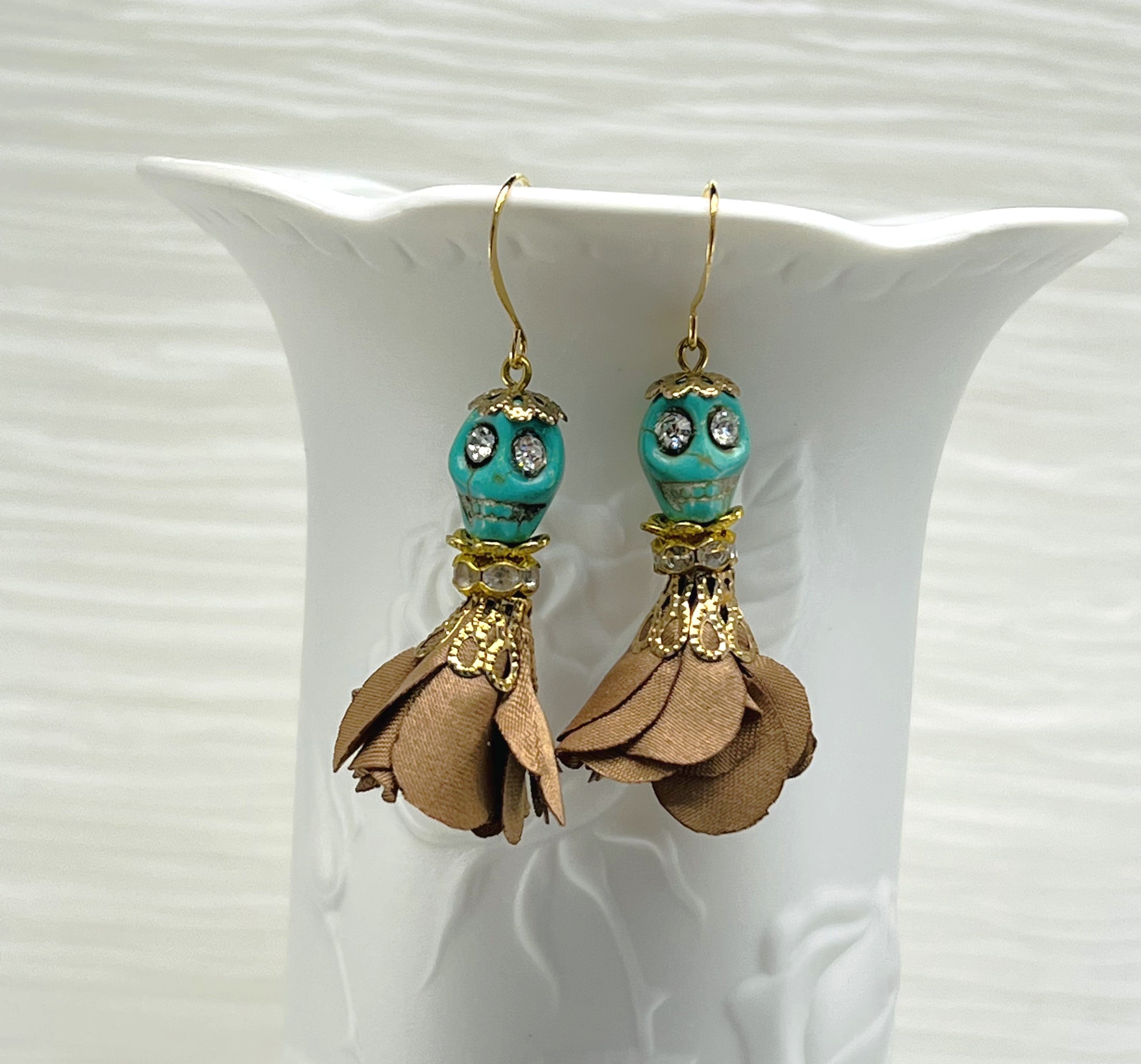 Sweet turquoise Wagnerite skull earrings with sparkly eyes and a lovely flowing brown silk skirt and gold accents