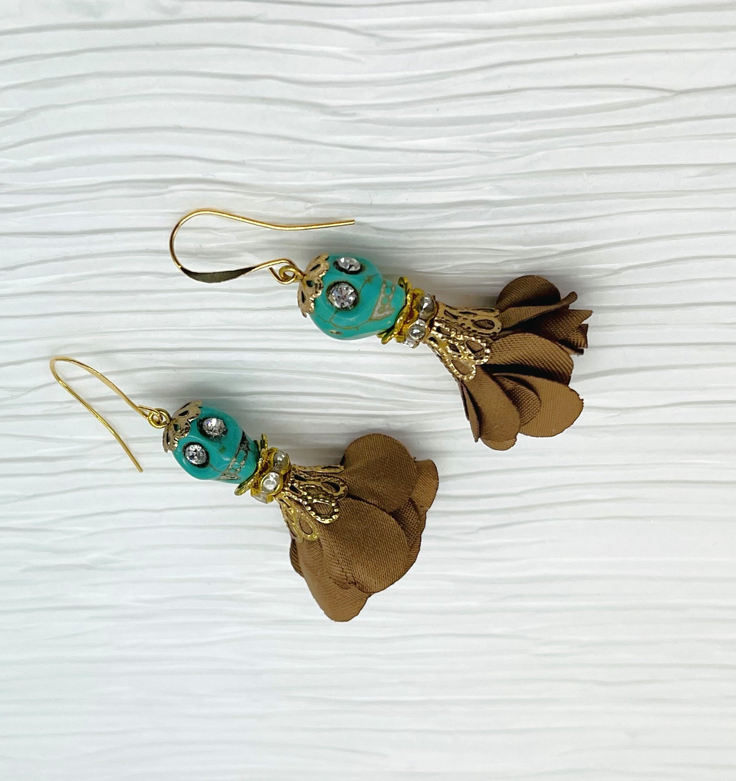 Sweet turquoise Wagnerite skull earrings with sparkly eyes and a lovely flowing brown silk skirt and gold accents