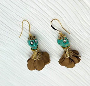 Sweet turquoise Wagnerite skull earrings with sparkly eyes and a lovely flowing brown silk skirt and gold accents