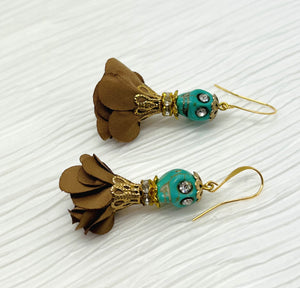 Sweet turquoise Wagnerite skull earrings with sparkly eyes and a lovely flowing brown silk skirt and gold accents