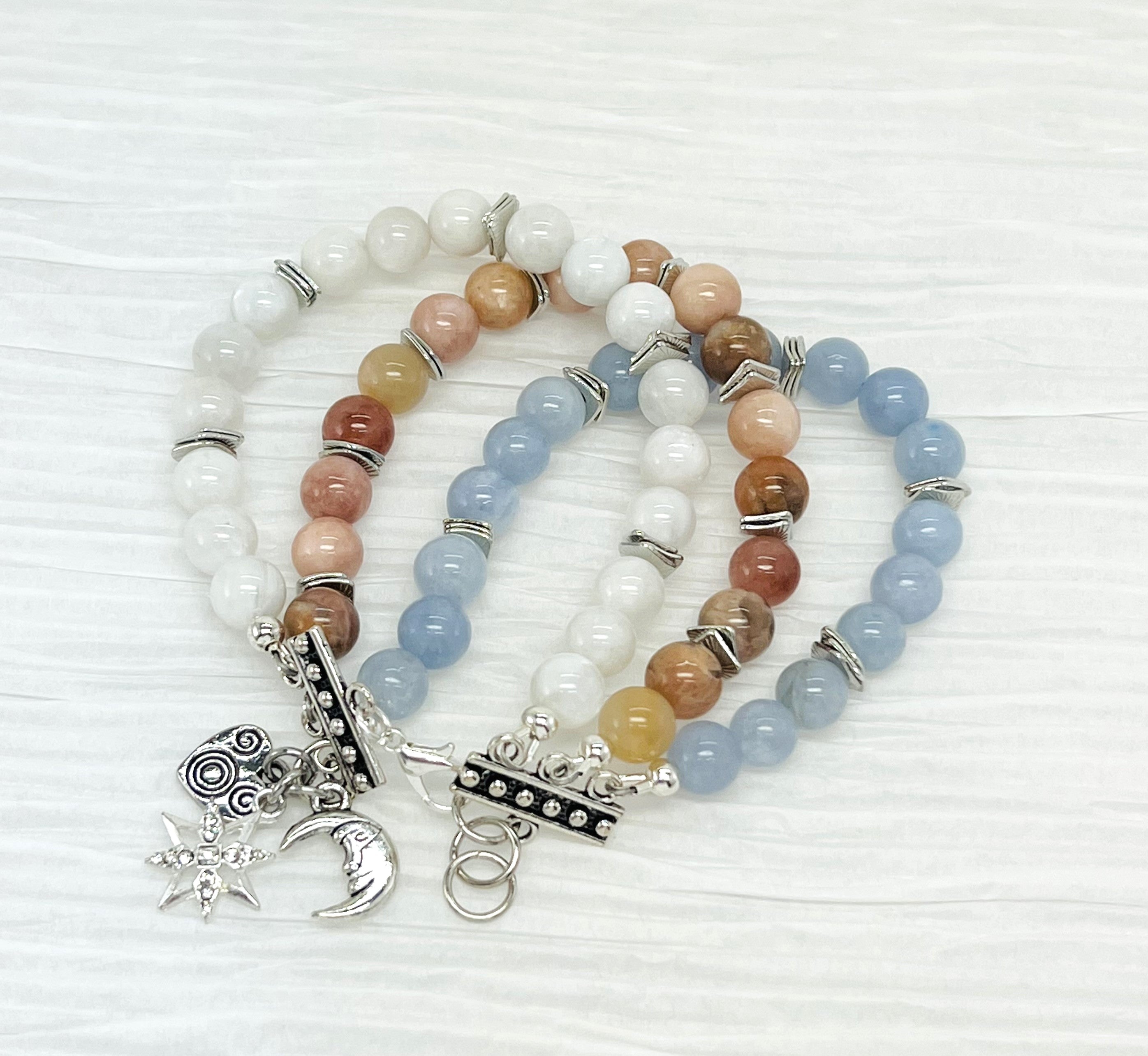 Mystical gemstones aquamarine, moonstone and sunstone combine in a calming balance of color and meaning