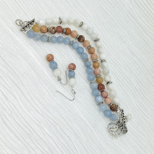 Mystical gemstones aquamarine, moonstone and sunstone combine in a calming balance of color and meaning