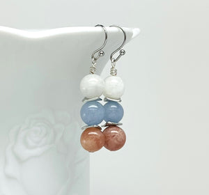 Mystical gemstones aquamarine, moonstone and sunstone combine in a calming balance of color and meaning