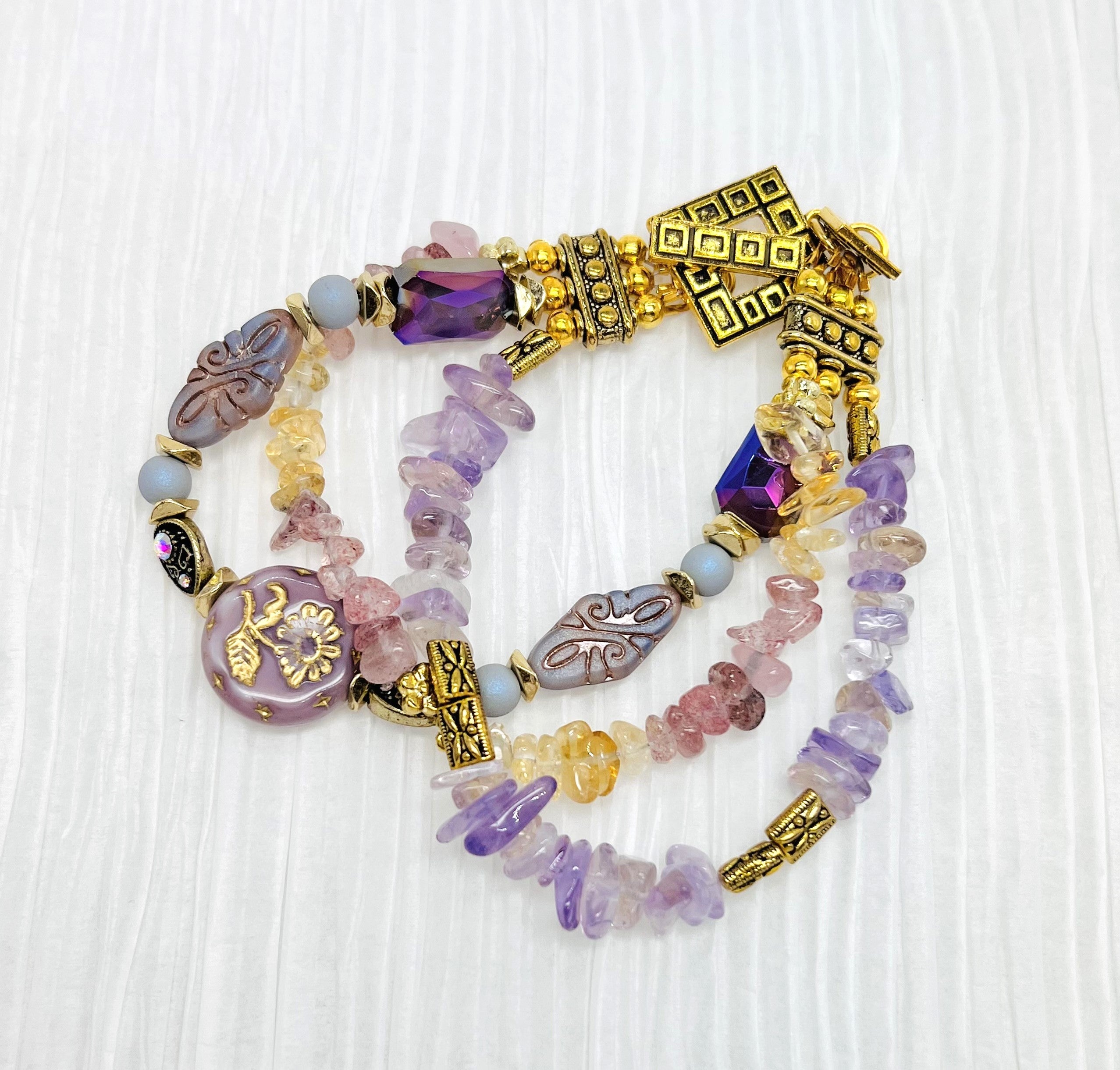 Czech glass and gemstones combined in warm yellow citrine, lavender ametrine and strawberry quartz with gold metal elements