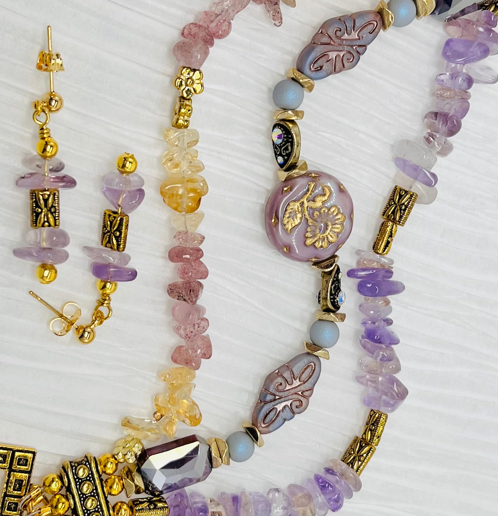 Czech glass and gemstones combined in warm yellow citrine, lavender ametrine and strawberry quartz with gold metal elements