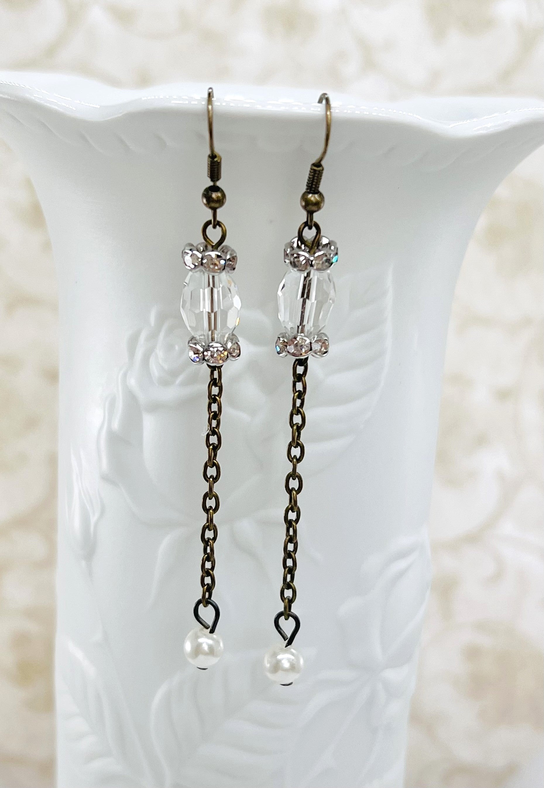 Victorian style earrings in antique brass with a crystal bead and sparkling rhinestone rondels and a pearl