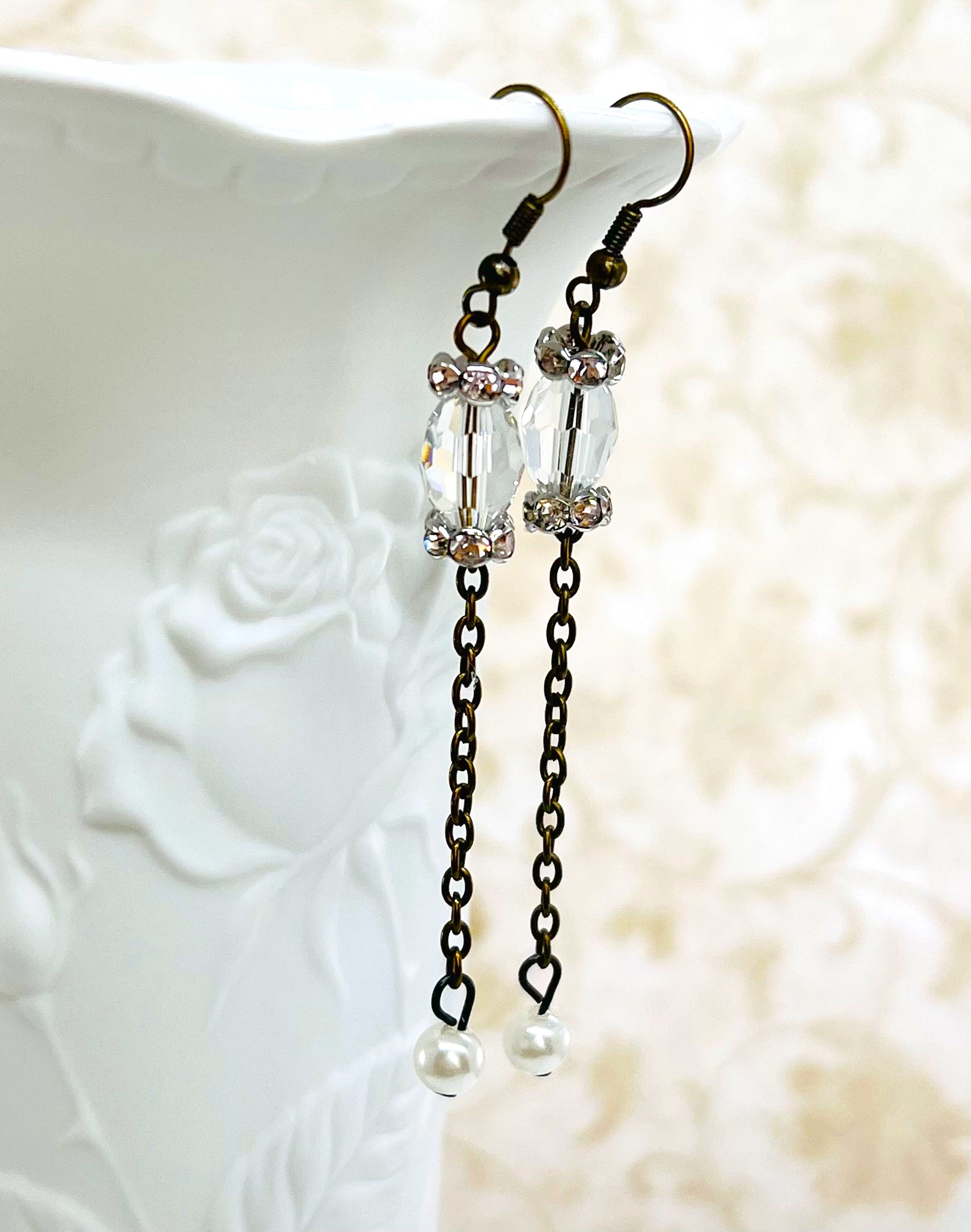 Victorian style earrings in antique brass with a crystal bead and sparkling rhinestone rondels and a pearl