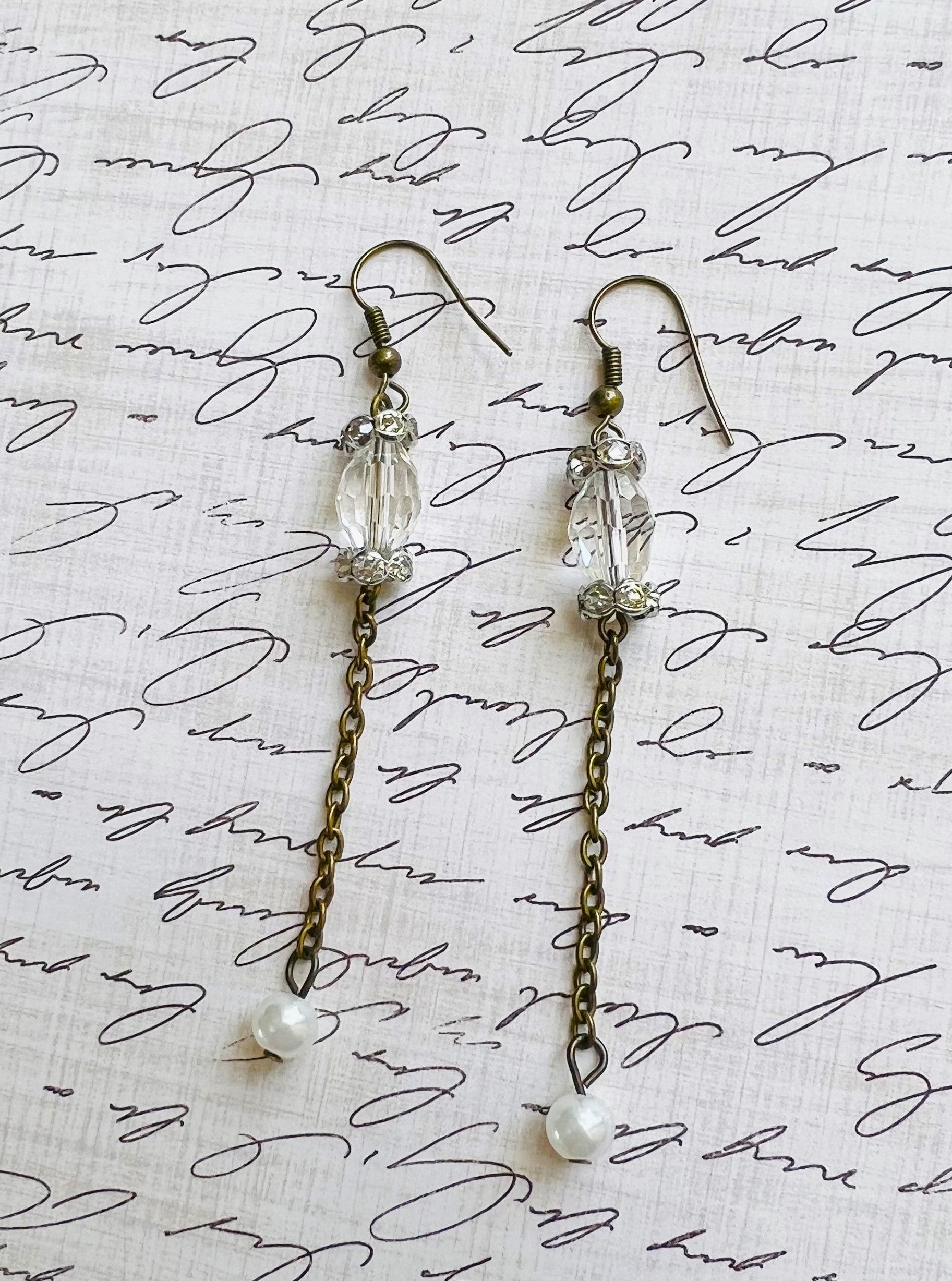 Victorian style earrings in antique brass with a crystal bead and sparkling rhinestone rondels and a pearl