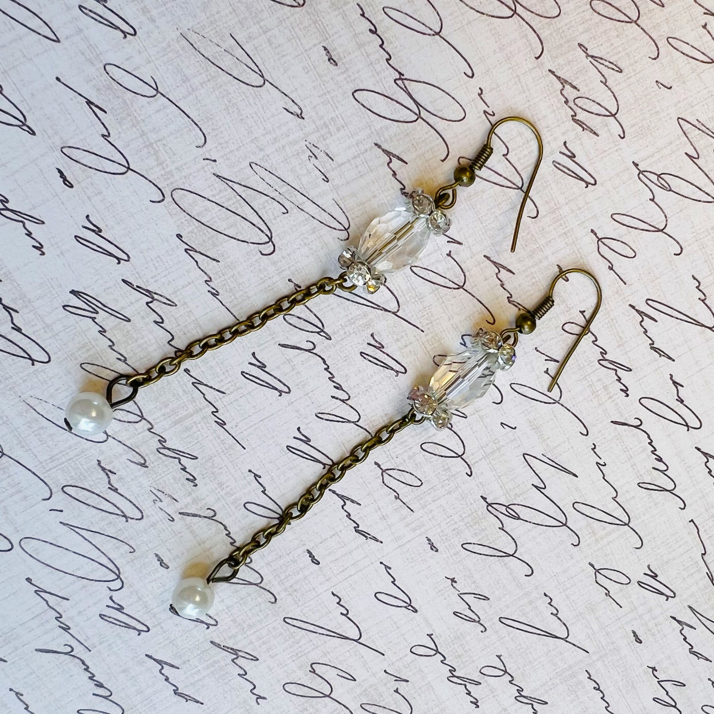 Victorian style earrings in antique brass with a crystal bead and sparkling rhinestone rondels and a pearl