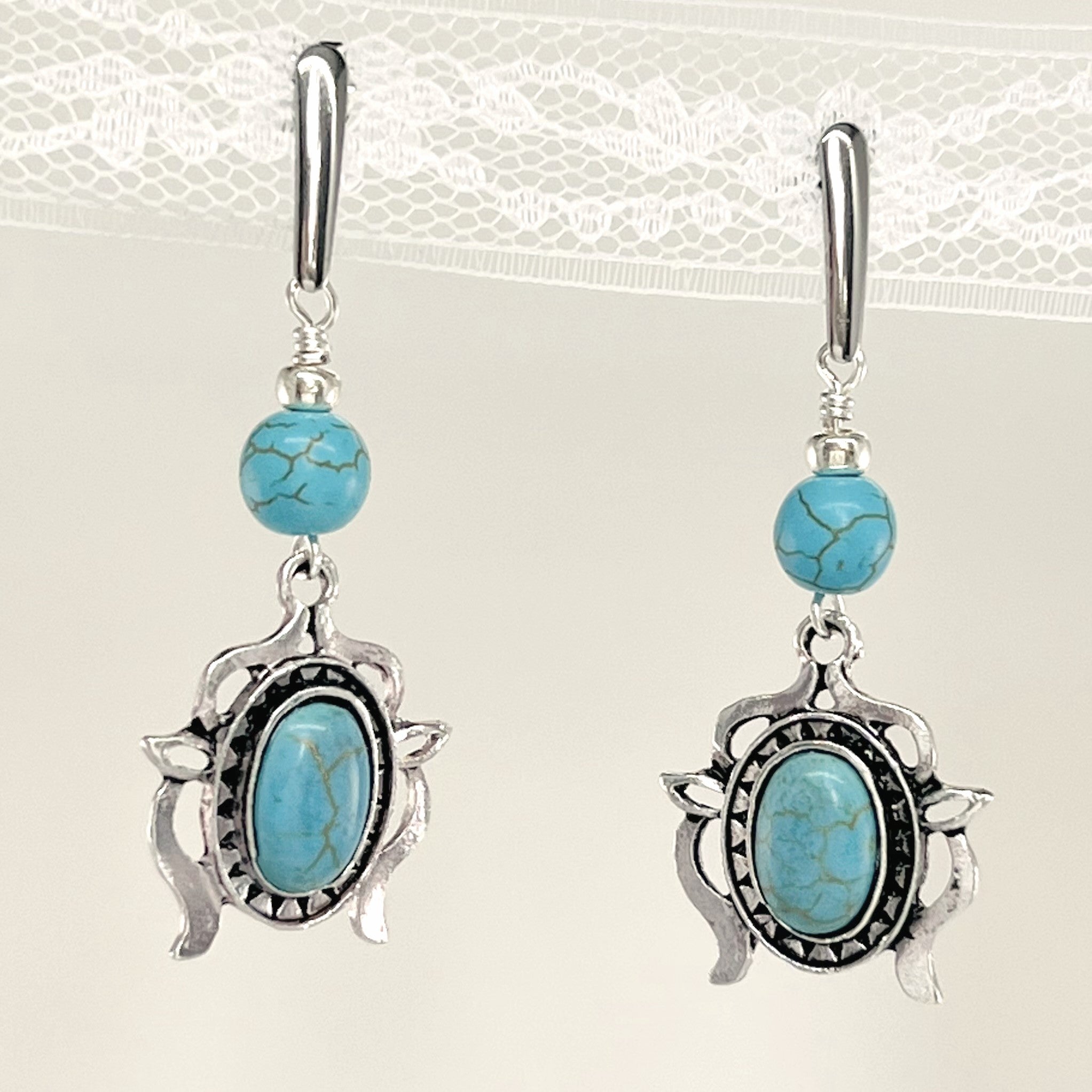 Statement necklace and earring set in turquoise howlite beads, silver accents and stunning ornately styled silver and turquoise focal