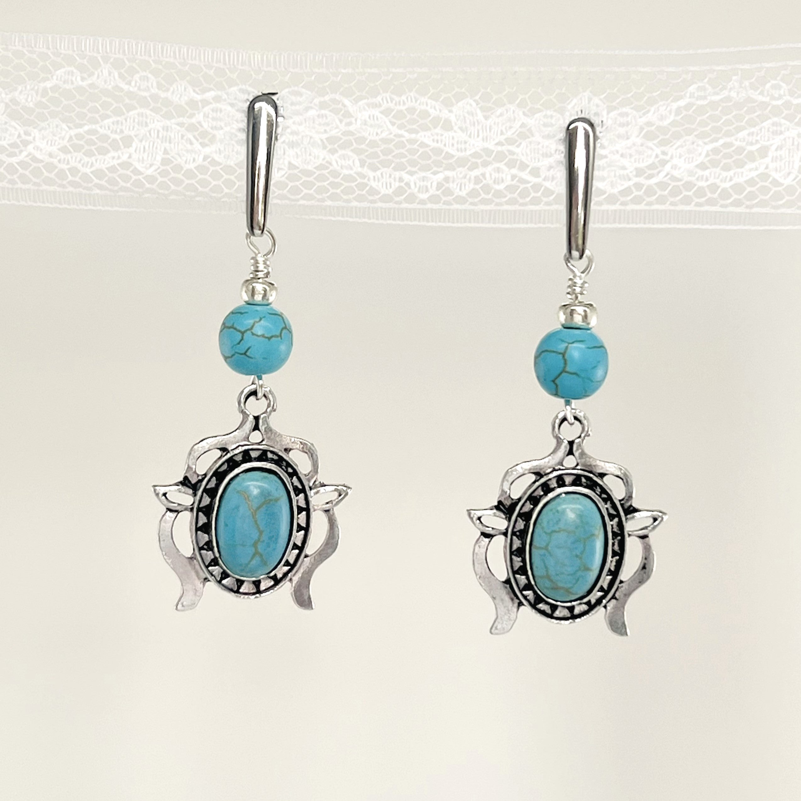 Statement necklace and earring set in turquoise howlite beads, silver accents and stunning ornately styled silver and turquoise focal