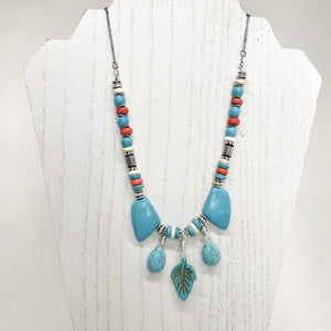 Statement necklace and earring set of turquoise howlite stones with cream, orange and silver accents