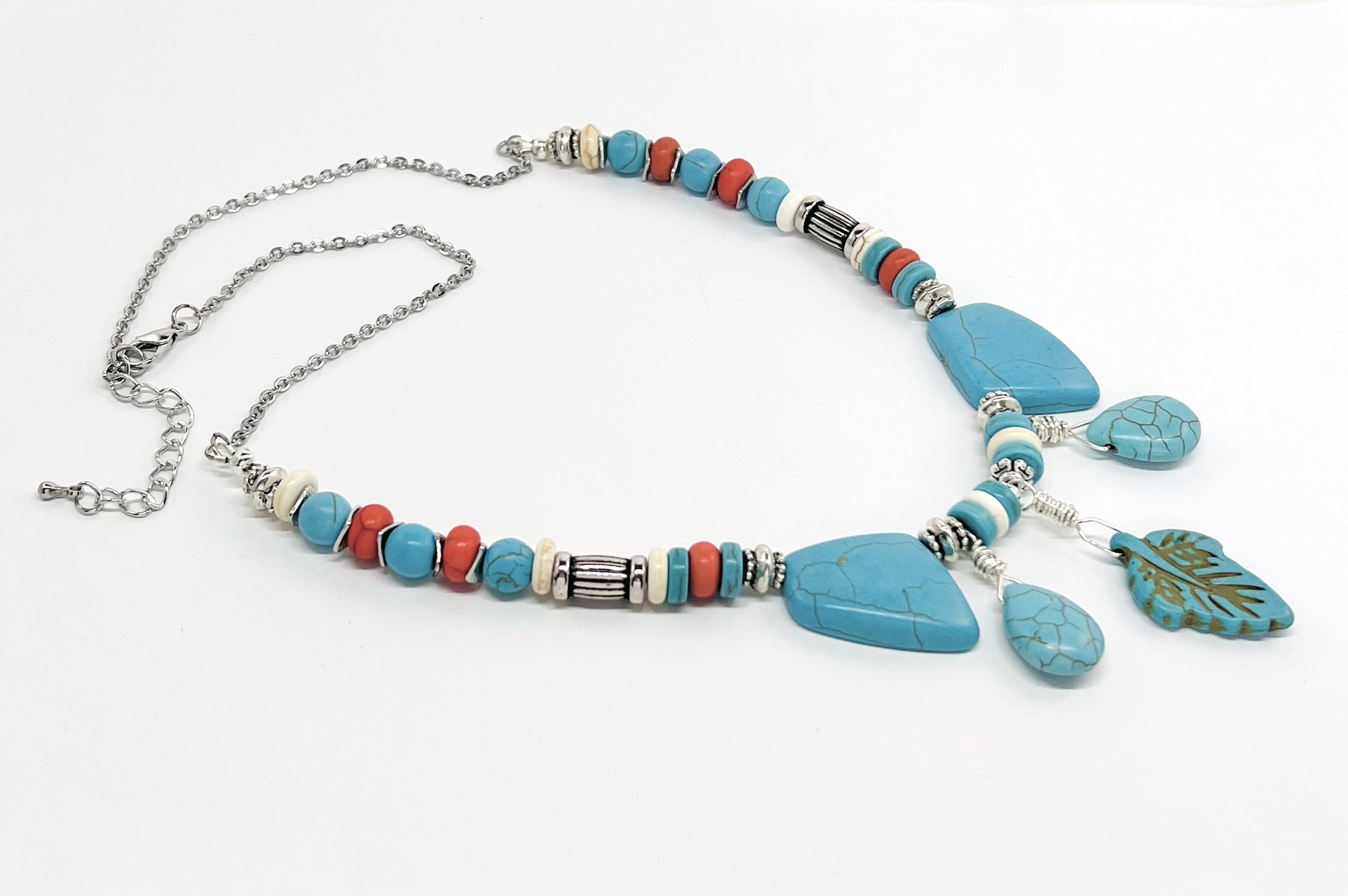 Statement necklace and earring set of turquoise howlite stones with cream, orange and silver accents