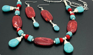 Statement necklace and earring set in turquoise howlite and deep red acrylic beads with silver accents