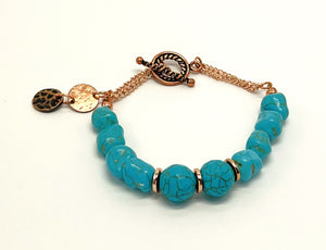 Bracelet and earring set in turquoise howlite round and chunk beads and copper