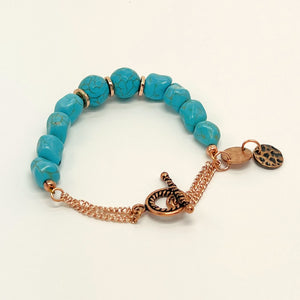 Bracelet and earring set in turquoise howlite round and chunk beads and copper