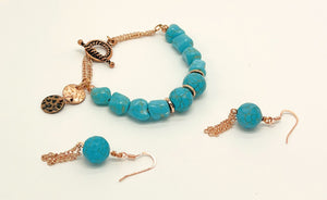 Bracelet and earring set in turquoise howlite round and chunk beads and copper