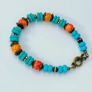 Bracelet and earring set in antique bronze, turquoise howlite and orange glass beads