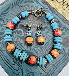 Bracelet and earring set in antique bronze, turquoise howlite and orange glass beads