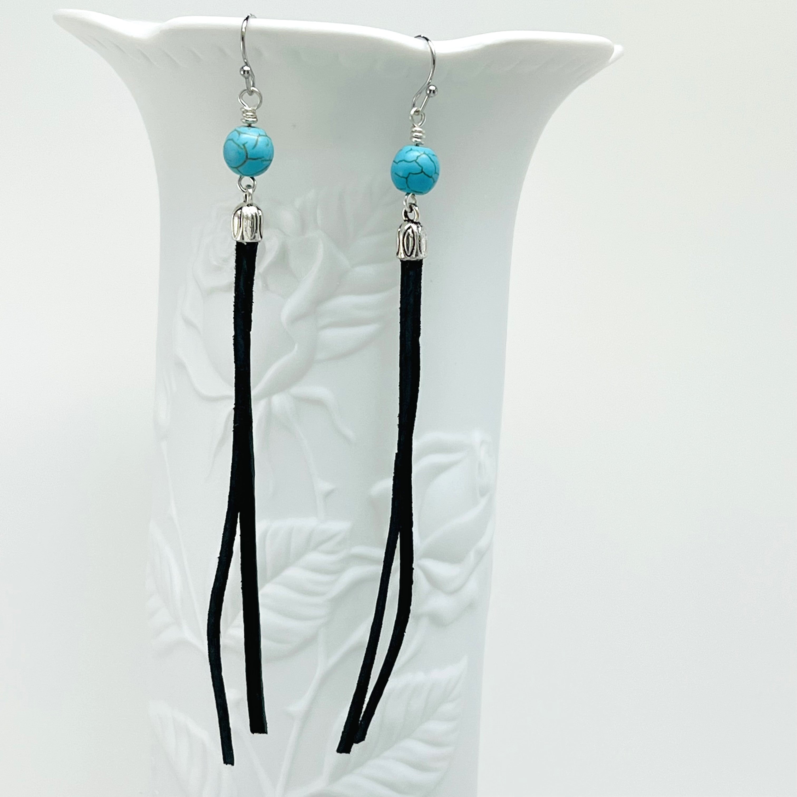 Leather earrings with turquoise Howlite stone beads with silver accents