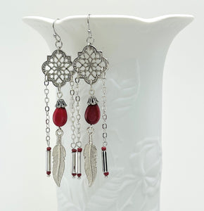 Powerful red stone tear drop earrings with silver accents and feather charms