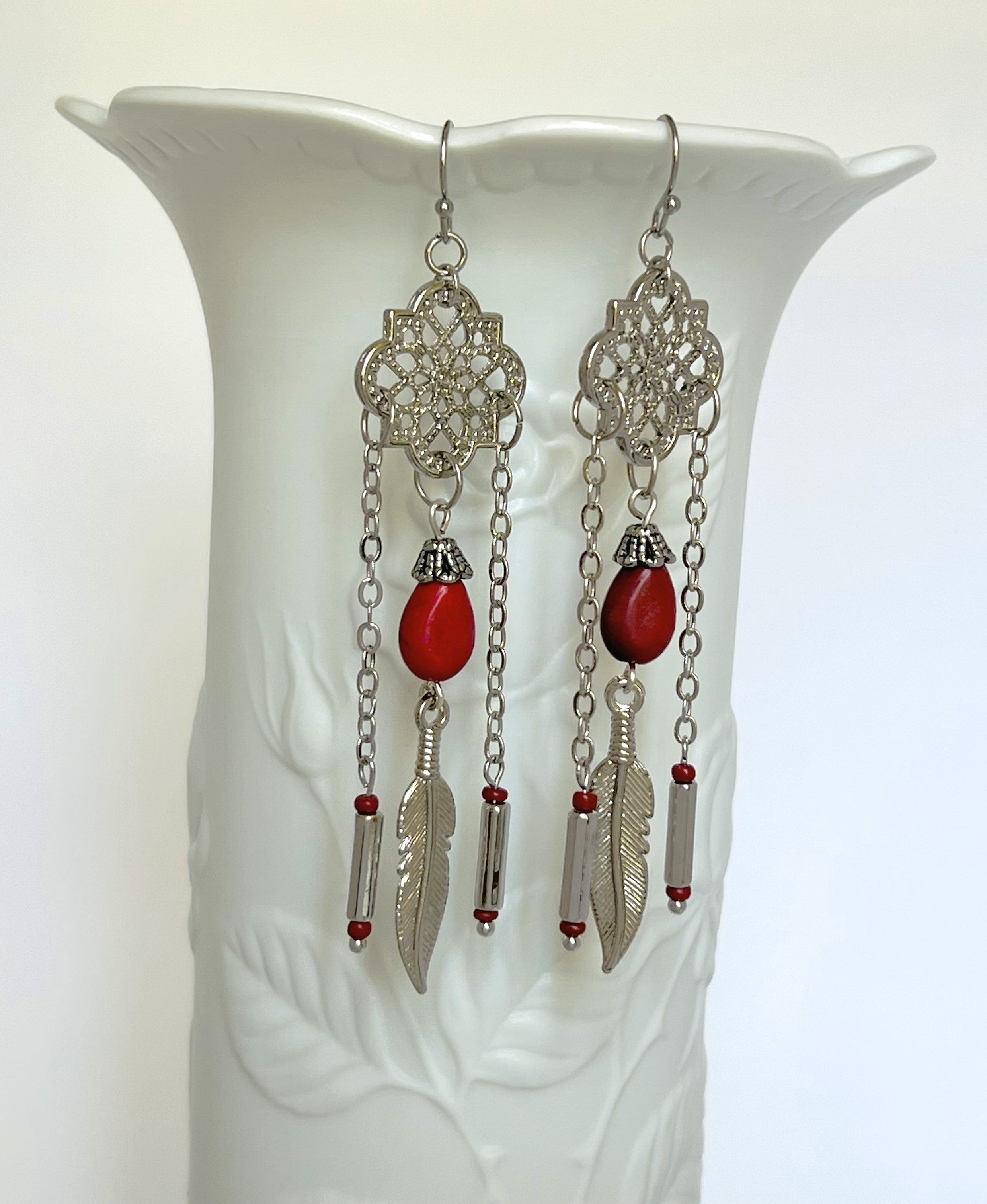 Powerful red stone tear drop earrings with silver accents and feather charms