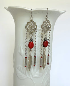 Powerful red stone tear drop earrings with silver accents and feather charms